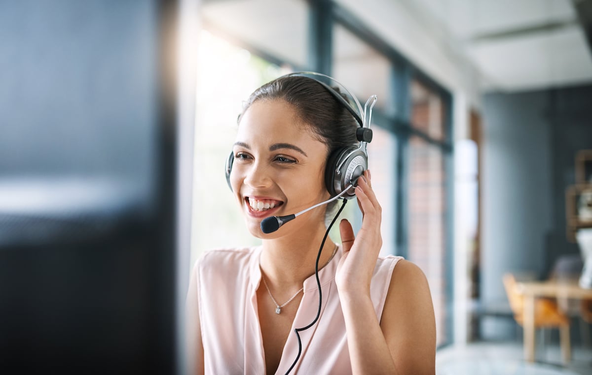 contact centre woman smiling talking to customer